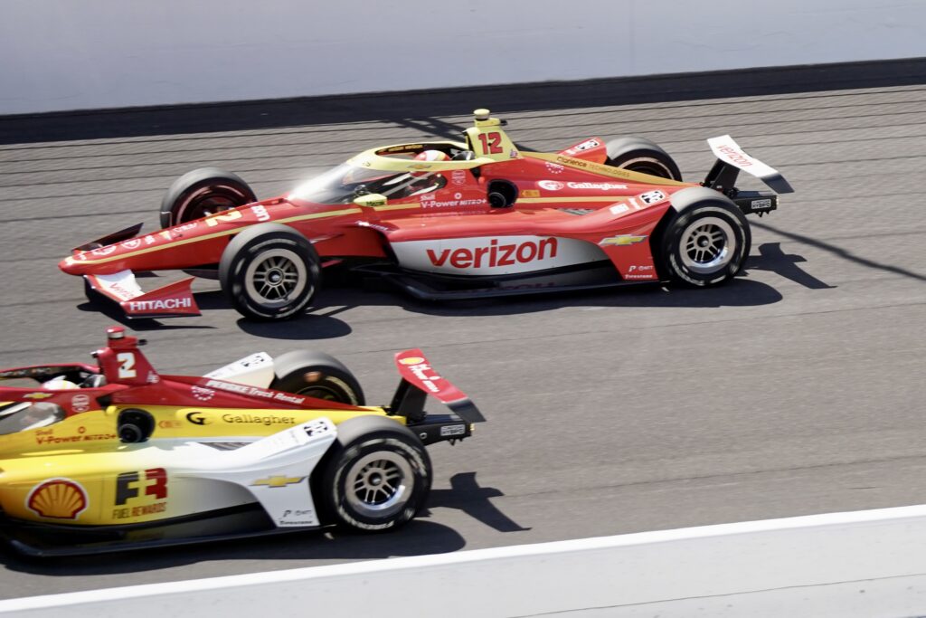 Two race cars at the 2026 Indy 500 one with a verizon logo