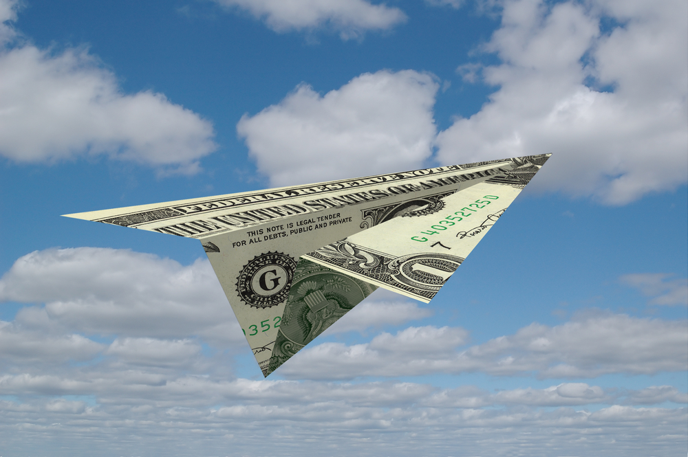 U.S. dollar paper airplane